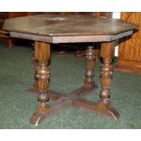 Oak octagonal table with carved supports, approximately 38 inches wide