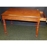 Mahogany library table with drawer at one end, raised on turned supports
