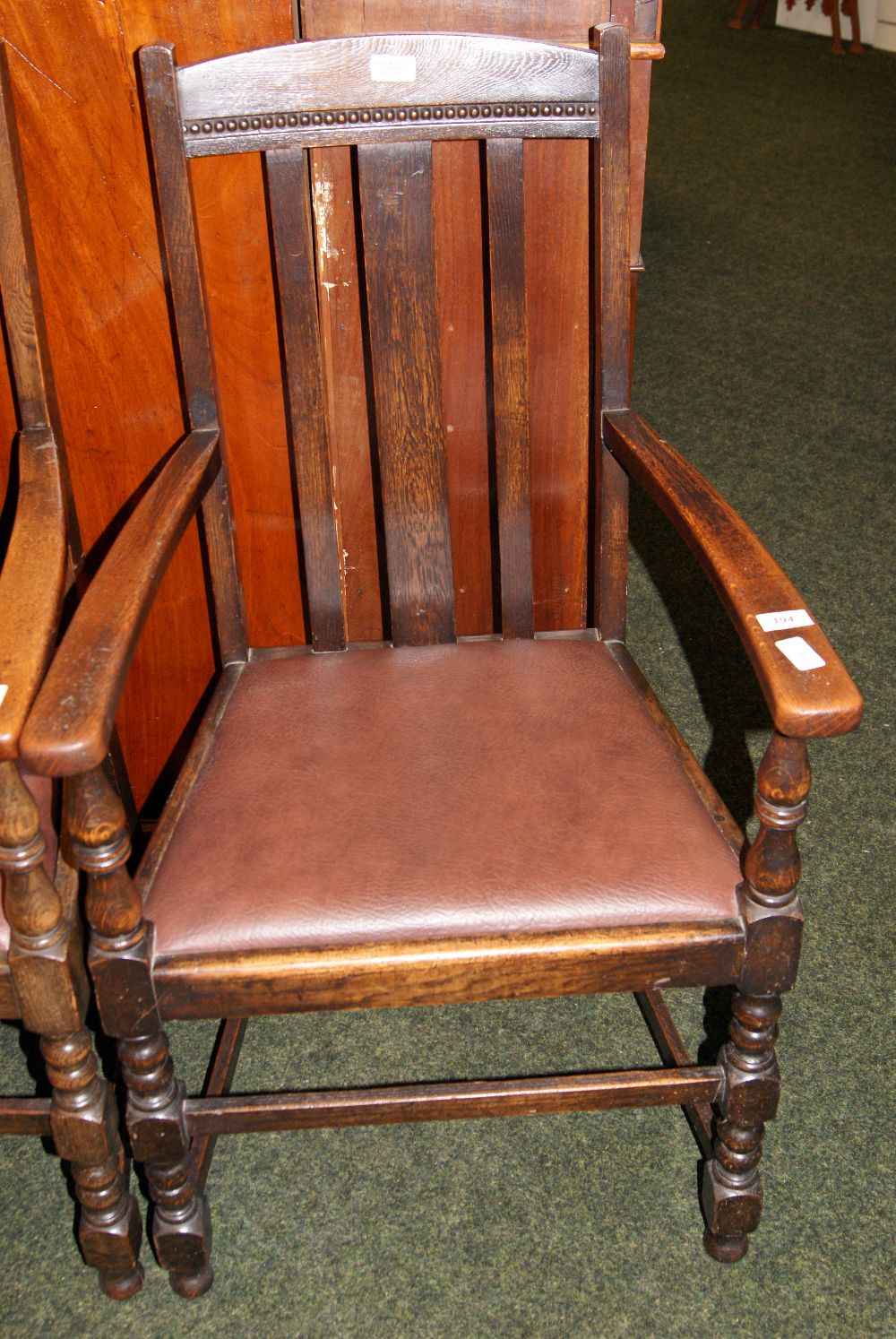 Two oak high-back carver dining chairs