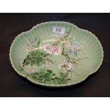 An 18th or 19th century Oriental celadon bowl, raised and painted detail to the lobed and shaped