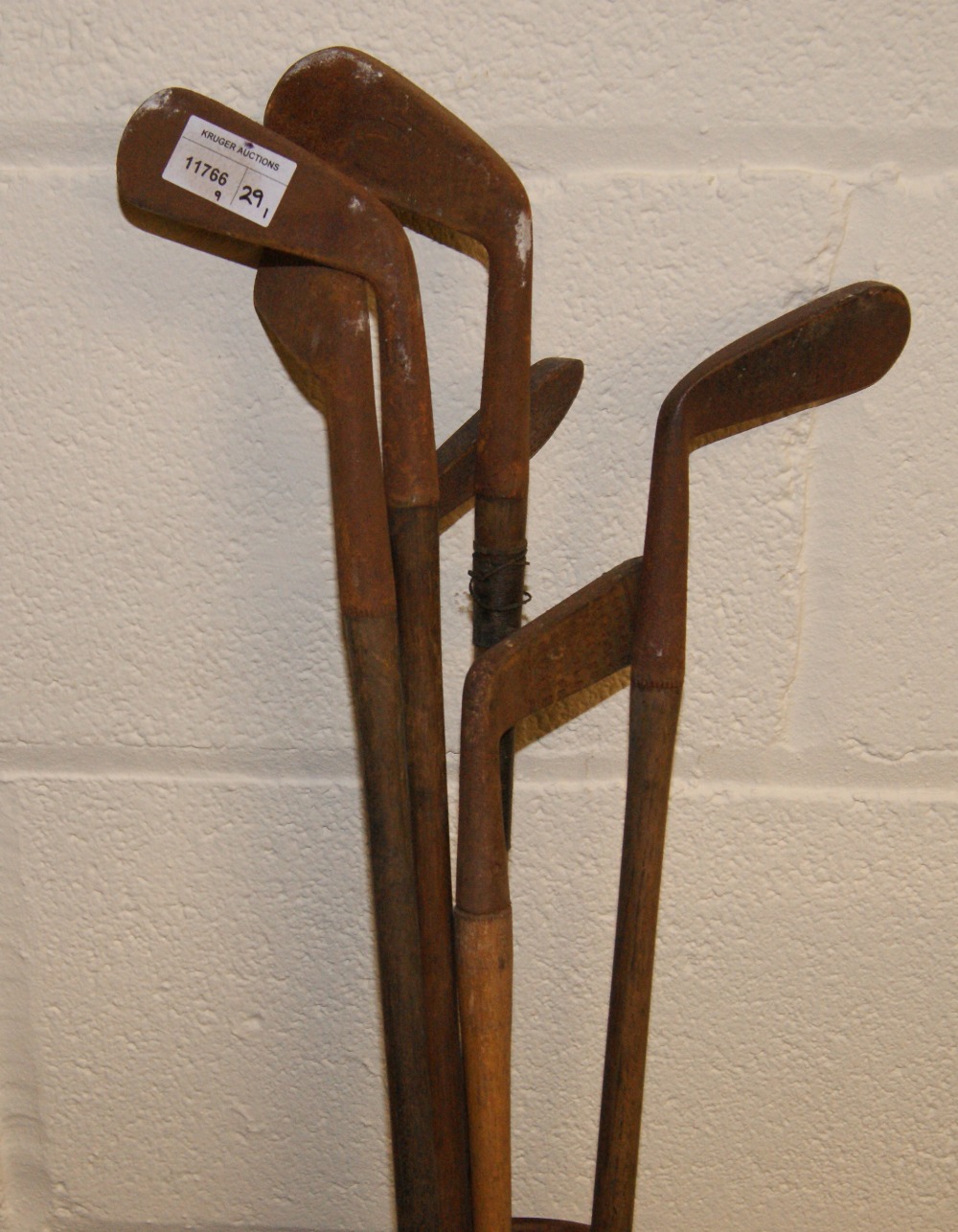 A selection of early hickory shafted golf irons and putters