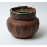 A late 18th - early 19th Century terracotta tobacco jar, with applied lead Grecian Key and figural