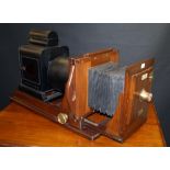 A Hunter-Penrose Ltd. mahogany and tin magic lantern of large proportions