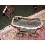 An antique toy pram (A/F)