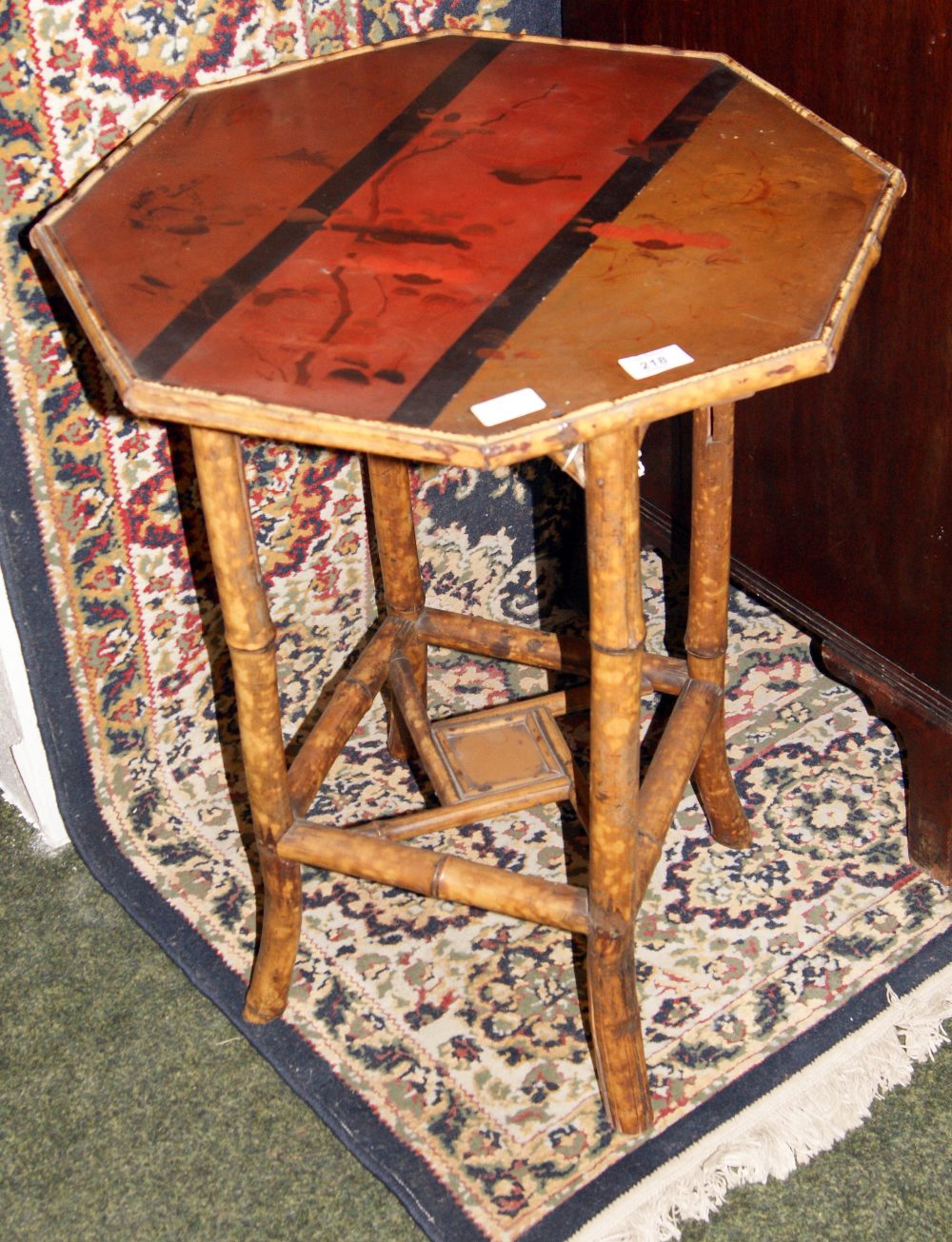 An Oriental lacquered bamboo octagonal lamp table