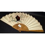 A 19th century painted and embroidered silk hand fan, with gilt details. Length approximately 337mm
