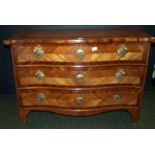 An 18th century Flemish oak and mahogany commode chest of three serpentine-fronted drawers,