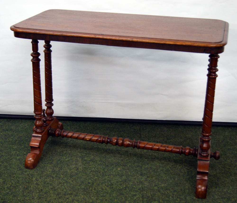 Rectangular mahogany loo table with turned supports and understretcher