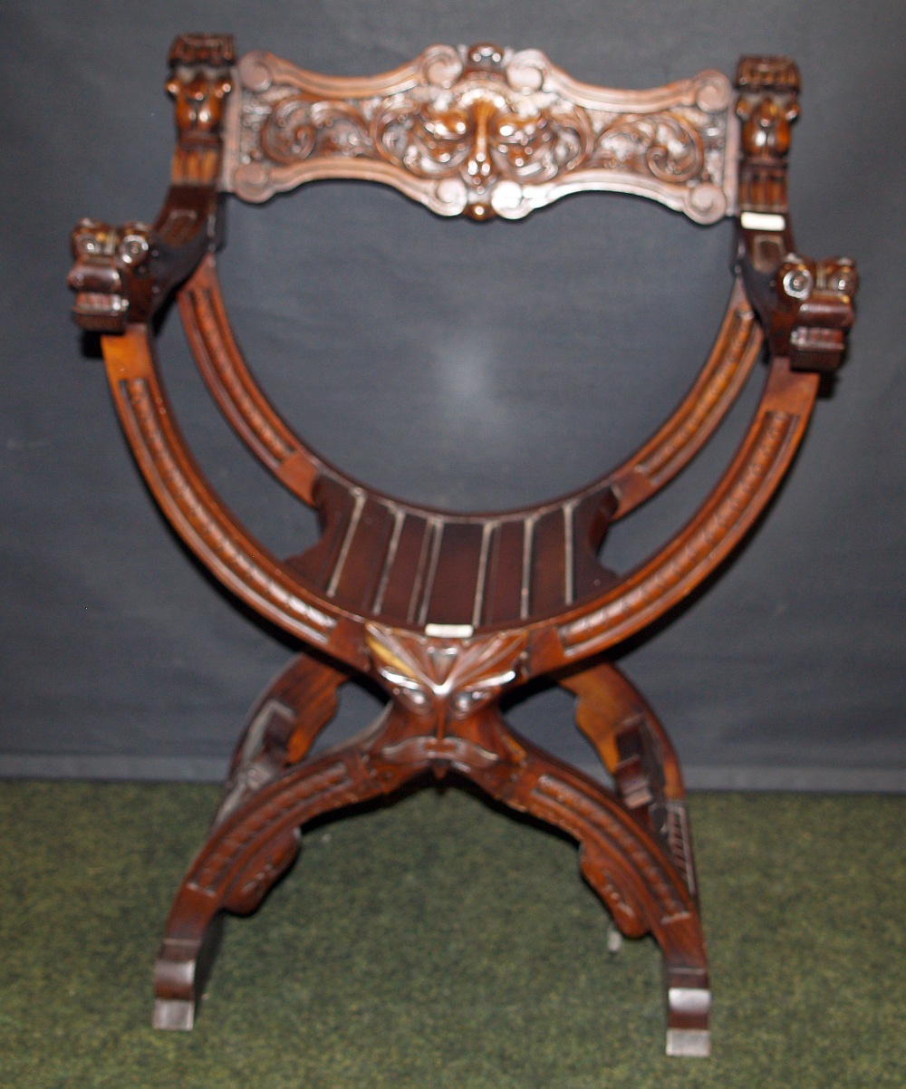 Reproduction mahogany Empire-style X-frame elbow chair