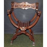 Reproduction mahogany Empire-style X-frame elbow chair