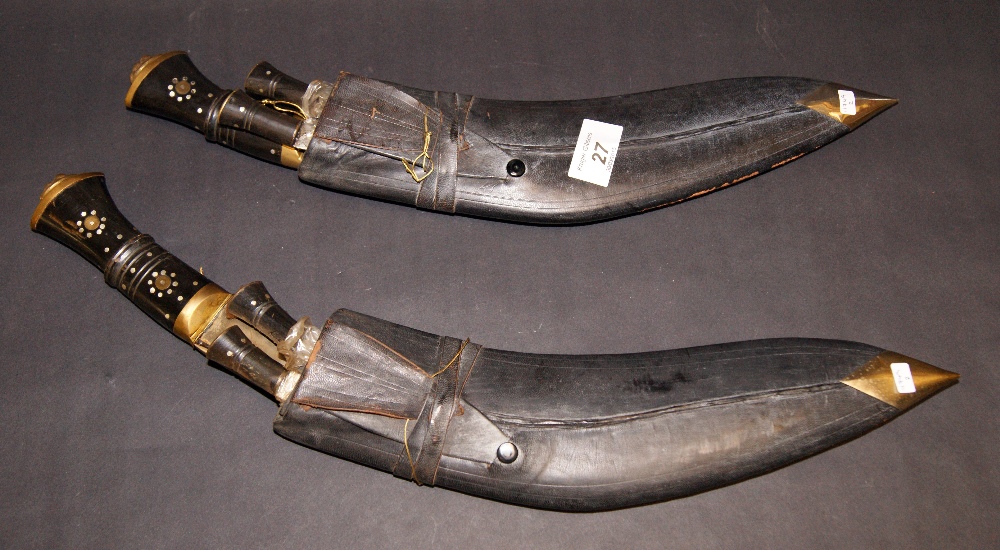 A pair of leather-cased kukris