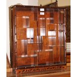 Curio cabinet with batwing shelves