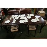 Darkwood wind-out table with four chairs plus two carvers