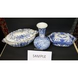 Two large blue-over-white decorated tureens, three Doulton Burslem "Norfolk" plates,