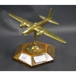 Brass desk paperweight of a vintage military aircraft