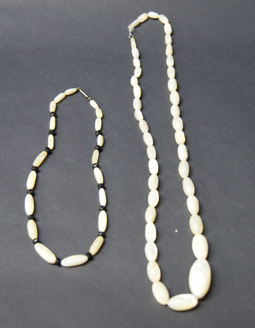 Large mother of pearl necklace plus another