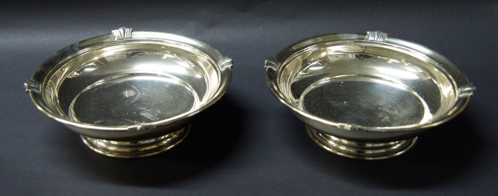 A hallmarked silver pair of footed bowls.