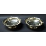 A hallmarked silver pair of footed bowls.
