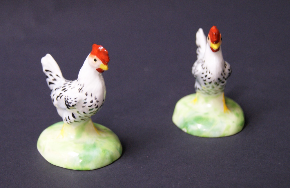 A pair of Crown Staffordshire painted ceramic cockerell miniature figures