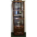 Chinese rosewood bookshelf with three short drawers and a door