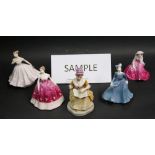 A selection of nine ceramic figurines of ladies in period costume,