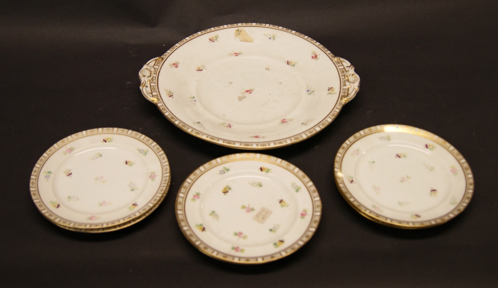 Dessert service comprising six side plates plus a cake plate decorated with pansies and gilt