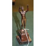 A miniature 19th Century figural bronze of a nude male, raised on a two-tone marble plinth.