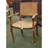 An oak Chinoiserie salon chair with bergère back and seat