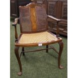 An oak and walnut salon chair with bergère back and seat