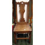 An 18th Century continental oak hall chair