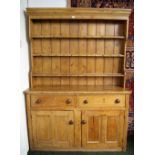 An early 19th Century pine dresser of large proportions,