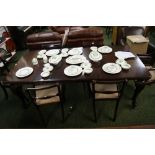 Mahogany wind-out table with two leaves and four chairs plus two carvers