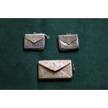 Three silver stamp holders (18g)