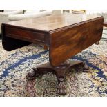 A Georgian mahogany sofa table raised on a quatrefoil base