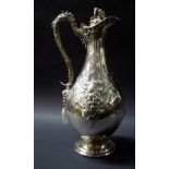 A 19th Century unmarked Continental silver-plated claret jug with hinged cover CONDITION REPORT; 315