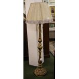 A heavily carved gilt pine standard lamp with a velum shade (not tested)