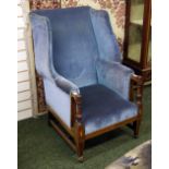 An inlaid mahogany Sheraton-style gentleman's wing-back arm chair