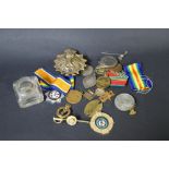 A selection of military badges and medals,