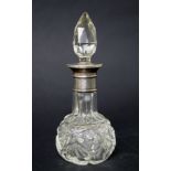 A hallmarked silver-topped perfume bottle,