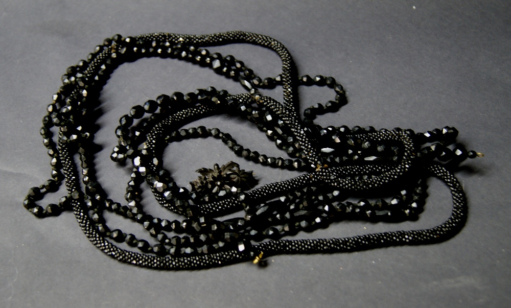 Two Victorian long jet necklaces, a smaller Victorian necklace,