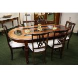 A contemporary cherrywood and glass dining table with six upholstered chairs