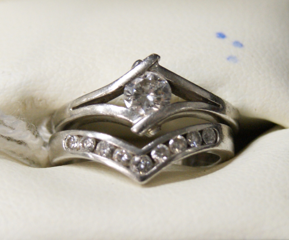 Diamond and platinum set engagement ring and a diamond and platinum set wedding ring to accord. - Image 2 of 2