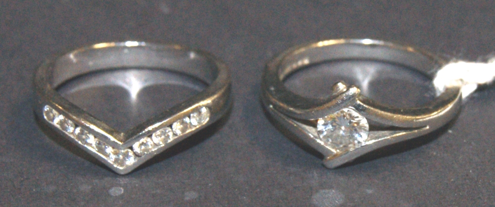 Diamond and platinum set engagement ring and a diamond and platinum set wedding ring to accord.