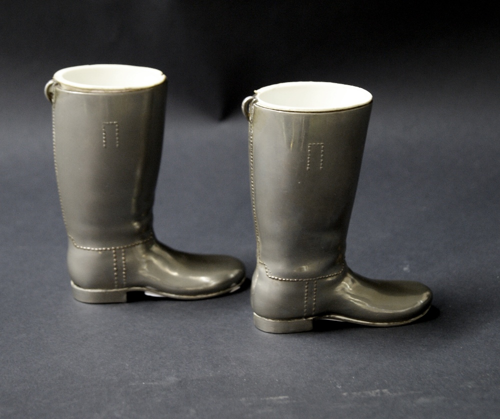 A pair of silver-plated vesta holders in the form of Wellington boots