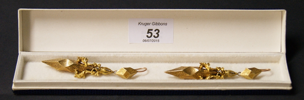 A pair of Victorian unmarked gold long drop earrings with engraved detail. Length approximately 8.