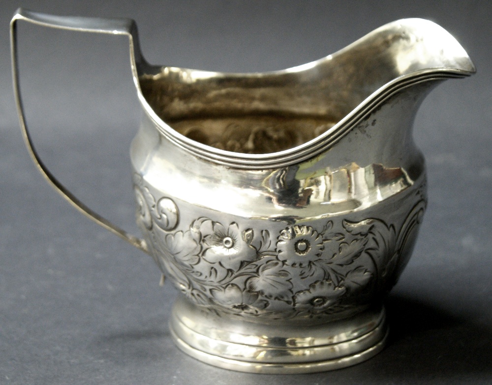 Georgian hallmarked silver jug with repoussé decoration. - Image 2 of 2