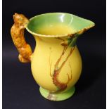 Burleighware; a ceramic pitcher with a moulded grip in the form of a squirrel.