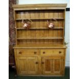 An early 19th Century pine dresser of large proportions,