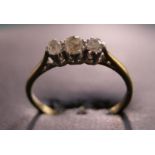 Gold three-stone diamond ring