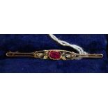 A Victorian 9ct gold ruby and seed pearl brooch